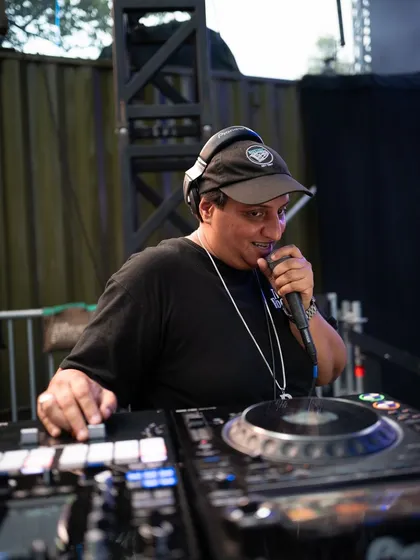 Behind the decks is where the magic starts. As a DJ and event producer, I'm hands-on with every detail, from the music selection to the final production, ensuring every party has the right vibe from start to finish.