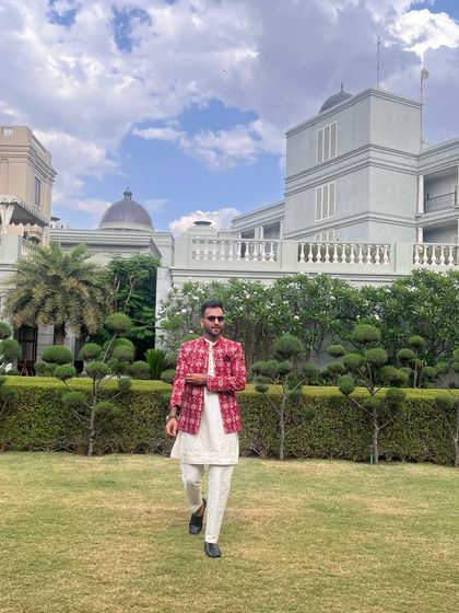 A classic ethnic look with a modern twist. The printed jacket over a simple kurta is perfect for a daytime wedding event.