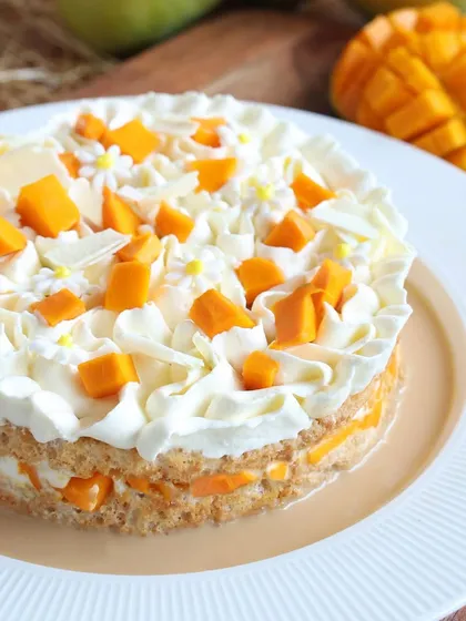 A closer look at the creamy, dreamy Mango Tres Leches, decorated with edible flowers for an extra touch of beauty.