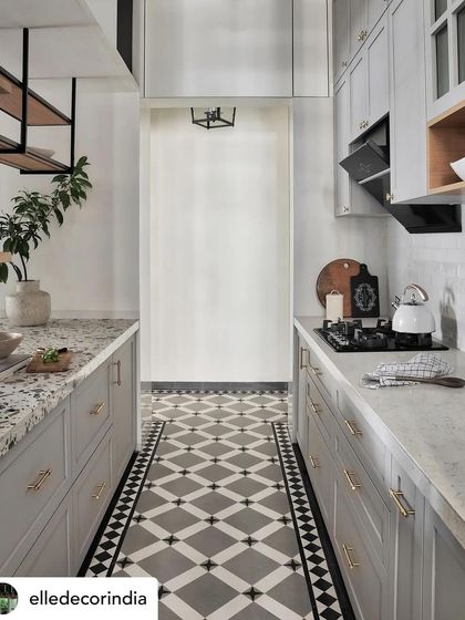 A feature in Elle Decor showcasing the Zen House kitchen. The concrete finish flooring pairs beautifully with shaker-style cabinets in a matte finish, creating a modern yet warm aesthetic.