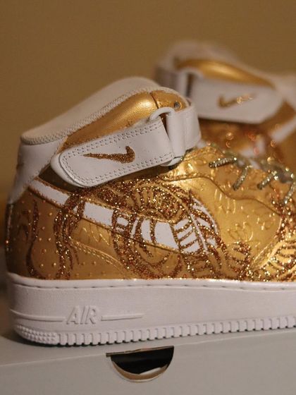 A touch of gold. This is my original take on Nike's "Dragon of the Year" theme. I used a satin gold base and fine glitter to create the dragon, giving these AF1 mids a luxurious and textured look.