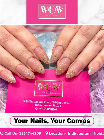 Another take on our popular gold glitter extensions. This set on long, almond-shaped nails is perfect for anyone who loves a classic, glamorous look that shines from every angle.
