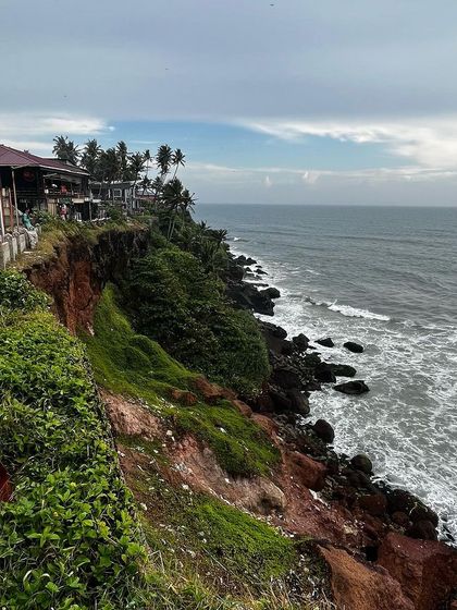 The stunning view of the Arabian Sea from the Varkala cliff, showing the unique red laterite cliffs.
