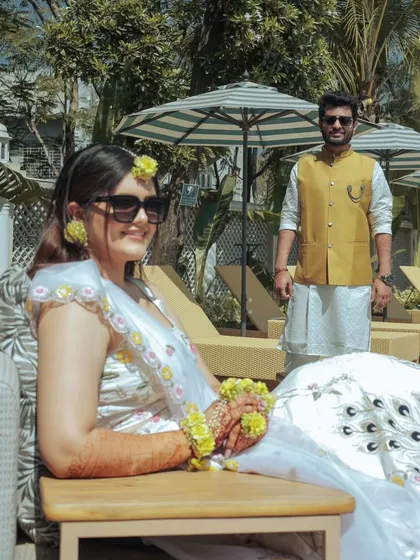 A candid shot of the bride relaxing while her groom looks on. This tells a little story and captures the dynamic between the couple.