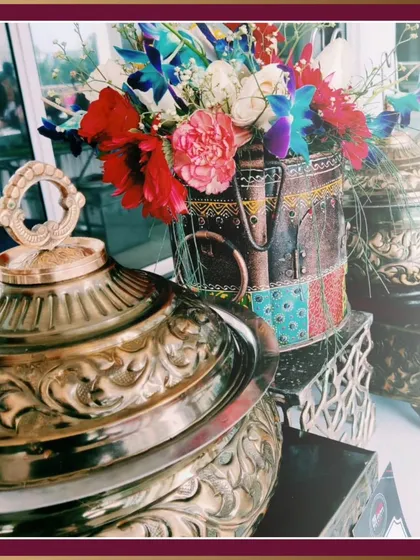 A close-up of our traditional, ornate serving dishes. We use authentic and high-quality serveware to enhance the presentation of our classic Indian cuisine, adding a touch of heritage to your event.