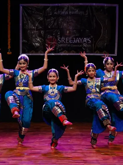The power and precision of the Kalakshetra style, demonstrated beautifully by this group of dancers. Their coordinated leaps show excellent form and training.