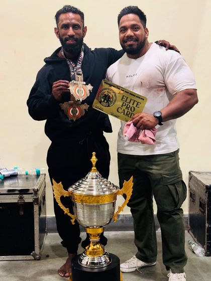 Another shot with the overall trophy and pro card. We work for these moments.