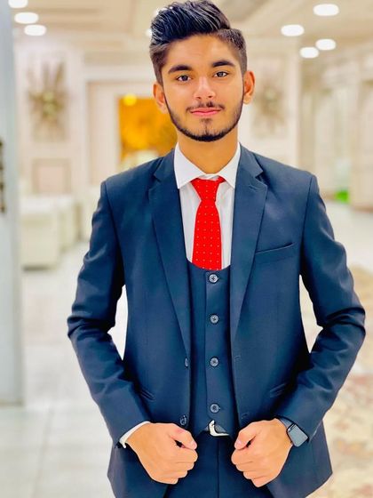 A party makeup look for a younger client. The grooming is age-appropriate, giving him a polished look without being overdone.