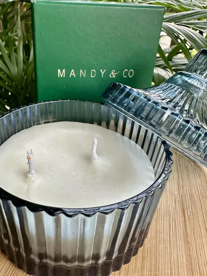 The vanilla ribbed glass candle, open to show the smooth soy wax and double wicks.