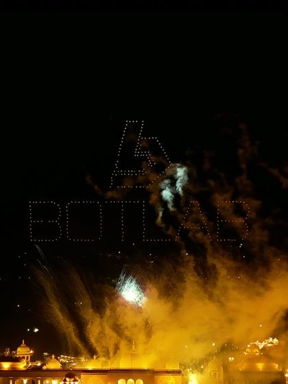 A stunning shot of our BotLab logo formed by drones, with fireworks exploding in the background. A perfect example of the magical moments our photographers capture.