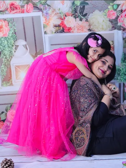 Another beautiful shot from a Mother's Day collaboration. This photo captures the protective and loving bond between a mother and her daughter in a beautiful floral setting.