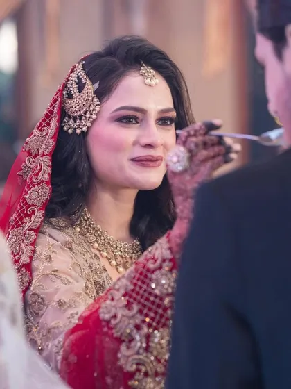 An emotional moment, with the bride's beautiful hairstyle holding perfectly.