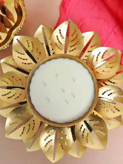 An overhead shot of the grand Lotus Urli Candle Bowl before it's lit, showing its seven wicks ready to create a spectacular display of light.