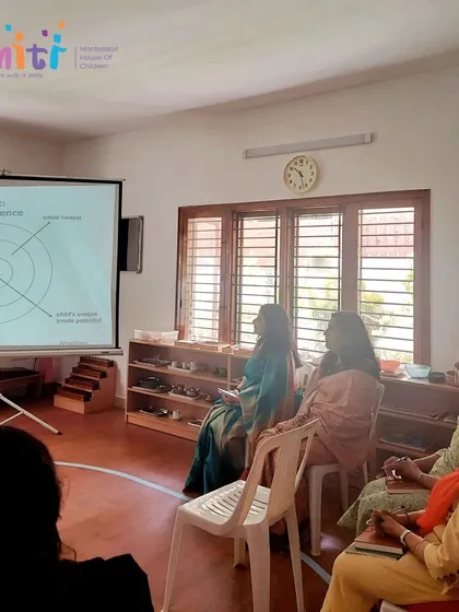 Teachers at Smiti Montessori listen intently during a professional development session. We believe continuous learning is the cornerstone of a thriving school.