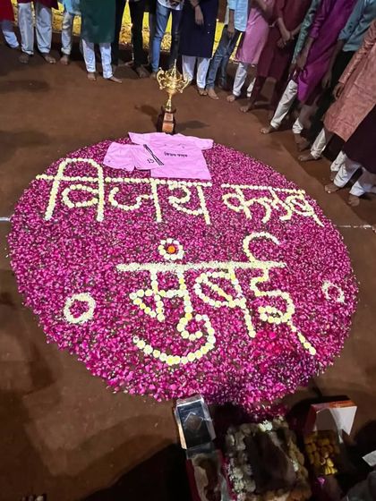 A beautiful flower rangoli with our club name, made for our special event.