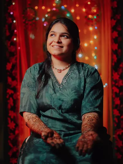 A beautiful portrait of the bride-to-be, her face lit with happiness and anticipation during her Mehndi ceremony.