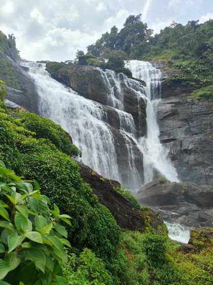 A closer view of the multi-tiered Mallalli falls, showcasing its power as it cascades down the rocks.