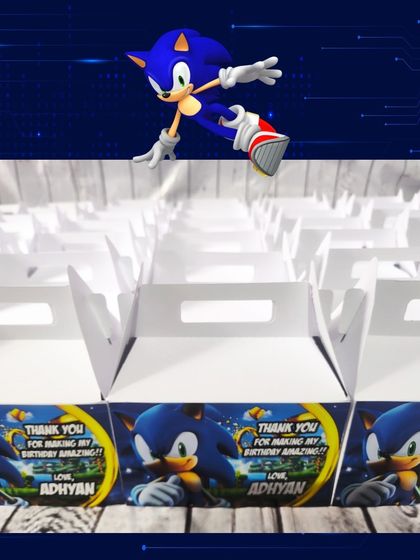 The custom-designed gable boxes for the Sonic party feature a thank you message and the birthday boy's name, Adhyan.