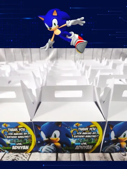 The custom-designed gable boxes for the Sonic party feature a thank you message and the birthday boy's name, Adhyan.