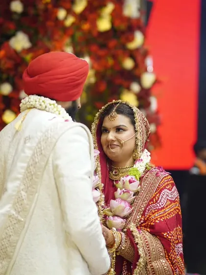 A candid over-the-shoulder shot during the wedding ceremony. The bride's loving gaze towards her groom is what makes this photo so special.
