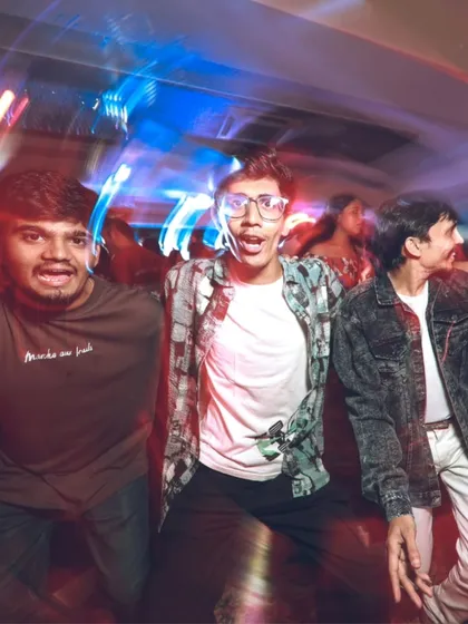 The excitement of a beat drop captured in a motion-blur photo. These high-energy moments are what make a party unforgettable.