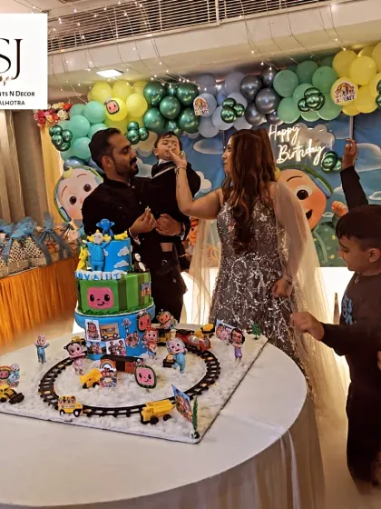 The cake-cutting moment is always special. The family gathered around the incredible Cocomelon cake, creating a perfect photo opportunity and a cherished memory.