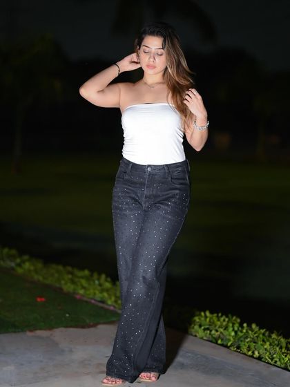 A candid-style night shot, capturing a natural and relaxed moment.