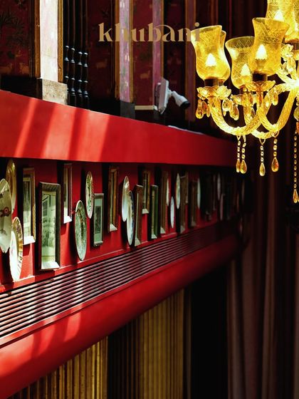 Welcome to a space where the glow is golden and every corner feels like a page from a royal diary. The intricate wall decor and hanging chandeliers create a soulful, luxurious silence.