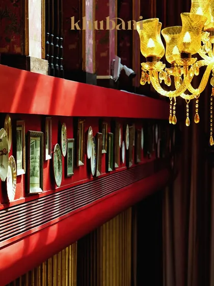 Welcome to a space where the glow is golden and every corner feels like a page from a royal diary. The intricate wall decor and hanging chandeliers create a soulful, luxurious silence.