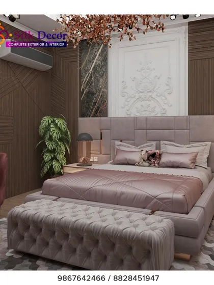 We designed this bedroom to be a true sanctuary. The centerpiece is a large, custom-upholstered bed in a sophisticated grey fabric, paired with a matching deep-tufted bench at its foot. This project highlights our ability to create coordinated bedroom sets that balance modern design with plush comfort.