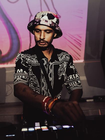 A focused shot of me at the decks, with the 'Salty' visuals projected behind me. Every gig is a chance to create a unique experience.