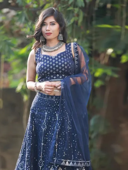 A classic portrait pose from our outdoor Heeramandi-inspired shoot. The soft natural light is perfect for highlighting the model's features and the details of the ethnic wear.