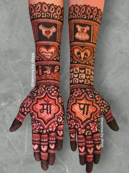 This baby shower design is filled with love, featuring 'Maa' and 'Pa' in Hindi. The arms are decorated with baby clothes, footprints, and hearts, symbolizing the love for the new arrival.