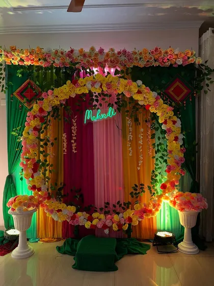 Another shot of the beautiful floral ring backdrop for a Mehndi party.