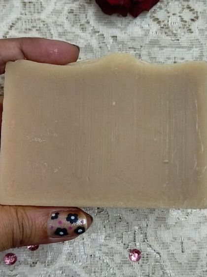 Holding a freshly cured bar of my 'Hoppyness' beer soap. The texture is smooth and the scent is subtly earthy. It's a great example of how I love to experiment with natural ingredients.