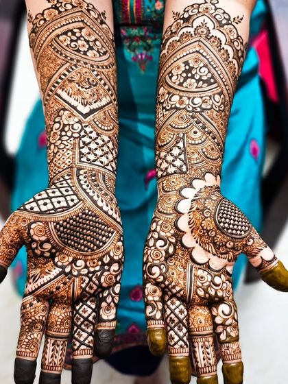 A bold and beautiful bridal design with a mix of heavy gridwork and delicate floral details.