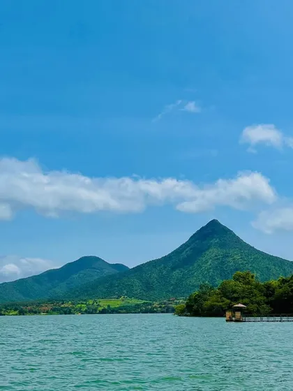 The serene waters and pyramid-like peak of Yagachi Dam near Chikmagalur. This is where we indulge in some thrilling water sports.