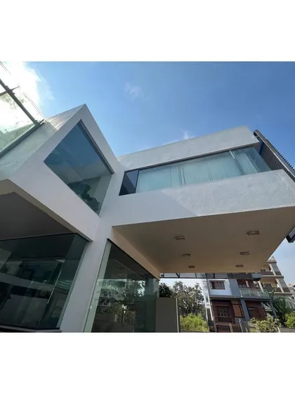 A detail of the cantilevered glass volumes of the 2010 office campus. The design plays with intersecting forms and transparency to create a dynamic workplace.