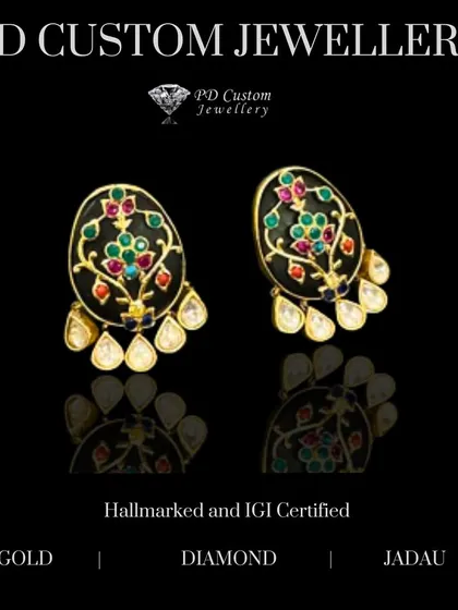 Dangling delights that steal the spotlight. These traditional earrings feature carved polki stones and colorful meenakari work, set in a classic Jadau style for a heritage look.