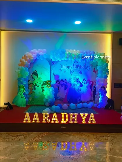 The full view of the Disney Princess 5th birthday stage with marquee letters.