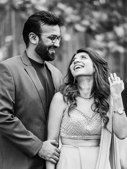 The pure, unadulterated joy of "we're engaged!". This black and white portrait captures that timeless feeling. It’s the laughter, the look in their eyes, and her hand showing off the ring that tells the whole story without a single word.