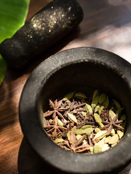 The secret to real flavour is starting from scratch. I source my whole spices directly from Wayanad and my mother helps me prepare our family's chilli and coriander powders. This commitment to authentic ingredients is the foundation of every dish.