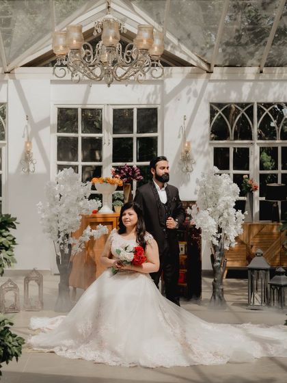 A grand, posed shot in the beautiful setting of Picture Villa. The smoke effect and elegant decor create a dramatic and cinematic atmosphere.