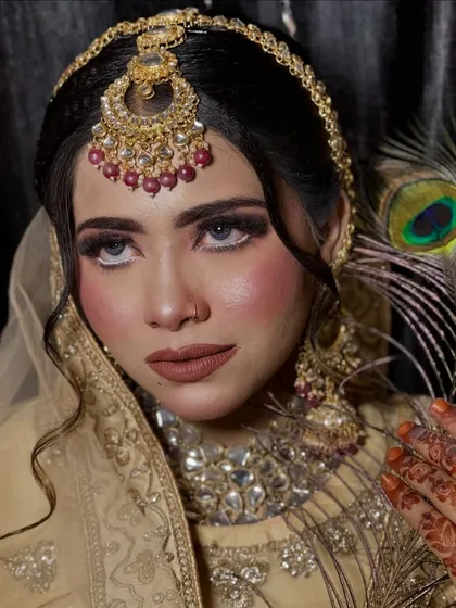 A beautiful portrait from a creative shoot. The makeup features a dark, smoky eye and a nude lip, creating a bold and captivating look.