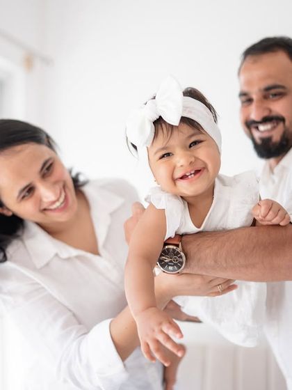 A playful family moment, full of laughter.