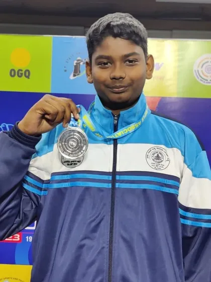 A close-up of Jonathan with his silver medal from the 66th NSCC mixed team event.