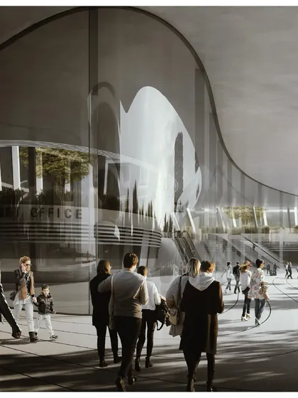 The curved glass facade of the station reflects the sky and surrounding greenery, creating a dynamic and ever-changing appearance.