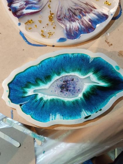 This shows a geode-inspired coaster being made in one of my custom-shaped molds. The smooth walls of the mold help achieve that glossy, glass-like finish on the final resin piece.