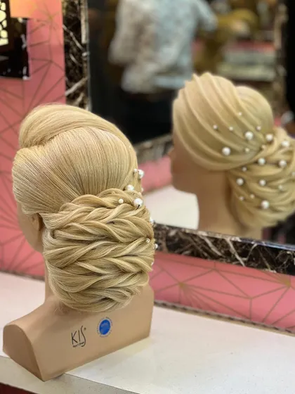Another view of the traditional low bun, showing its reflection in the mirror.
