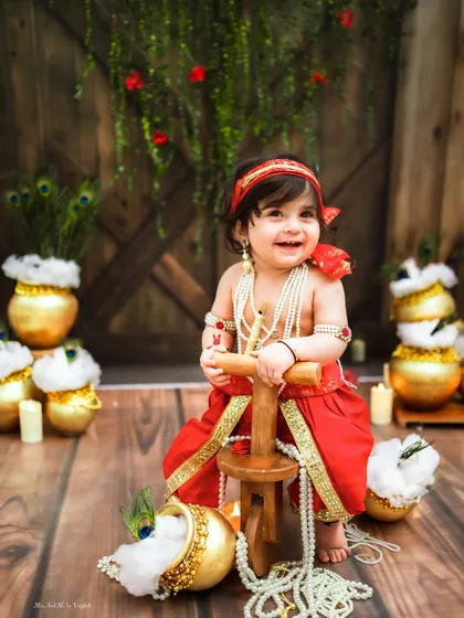 A happy Ladoogopal with his wooden tricycle. The joy on his face is what these festive sessions are all about.